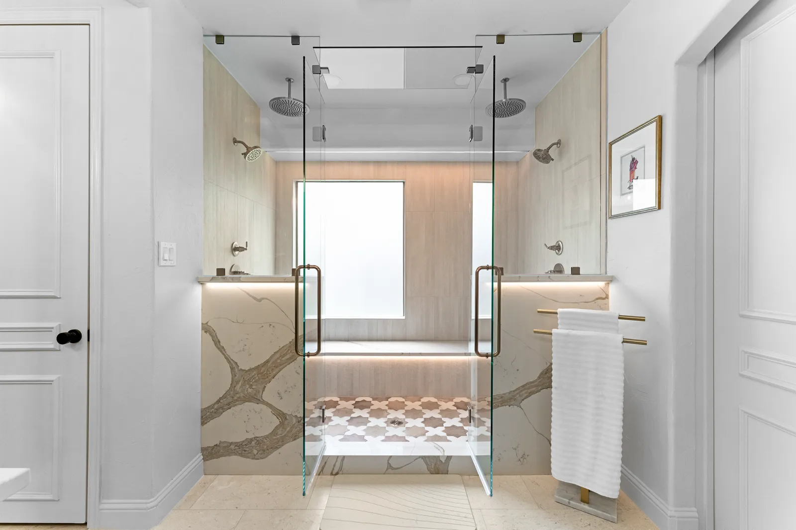 Borghini quartz slab shower walls with a glass enclosure in a Plano, TX primary bathroom